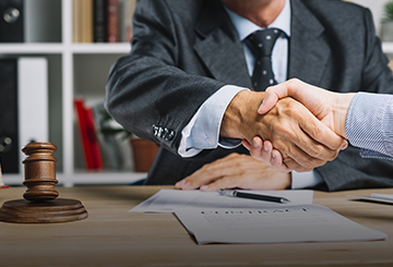 Businessman shaking hands to seal a dea